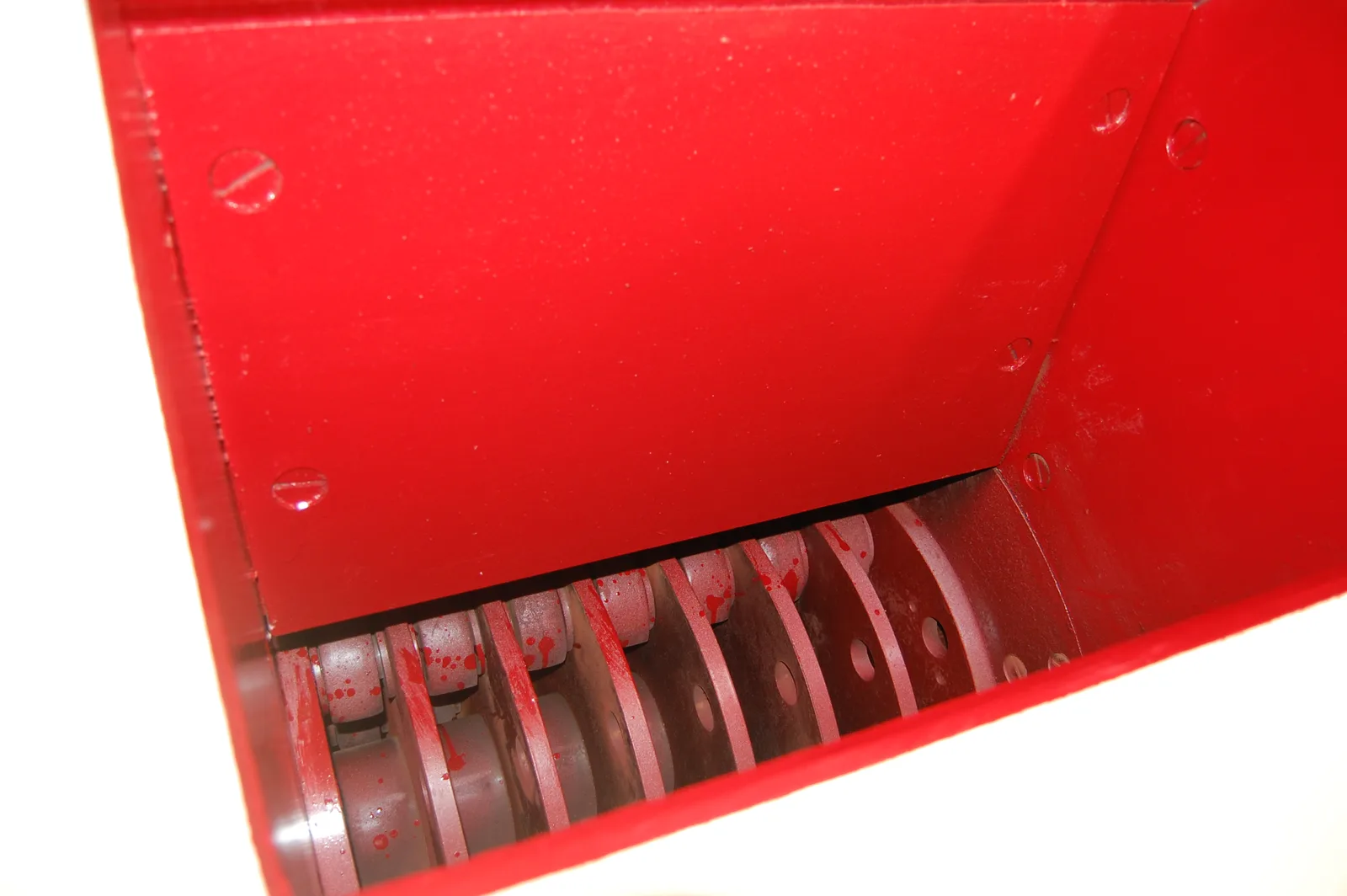 Close view into a hammer crusher showing the rotor discs and replaceable hammers